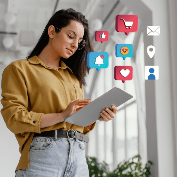 photo of a lady holding a tablet and coming out of it are icons of different social media platforms, just like what a social media marketing specialist utilizes whether working full-time or part-time